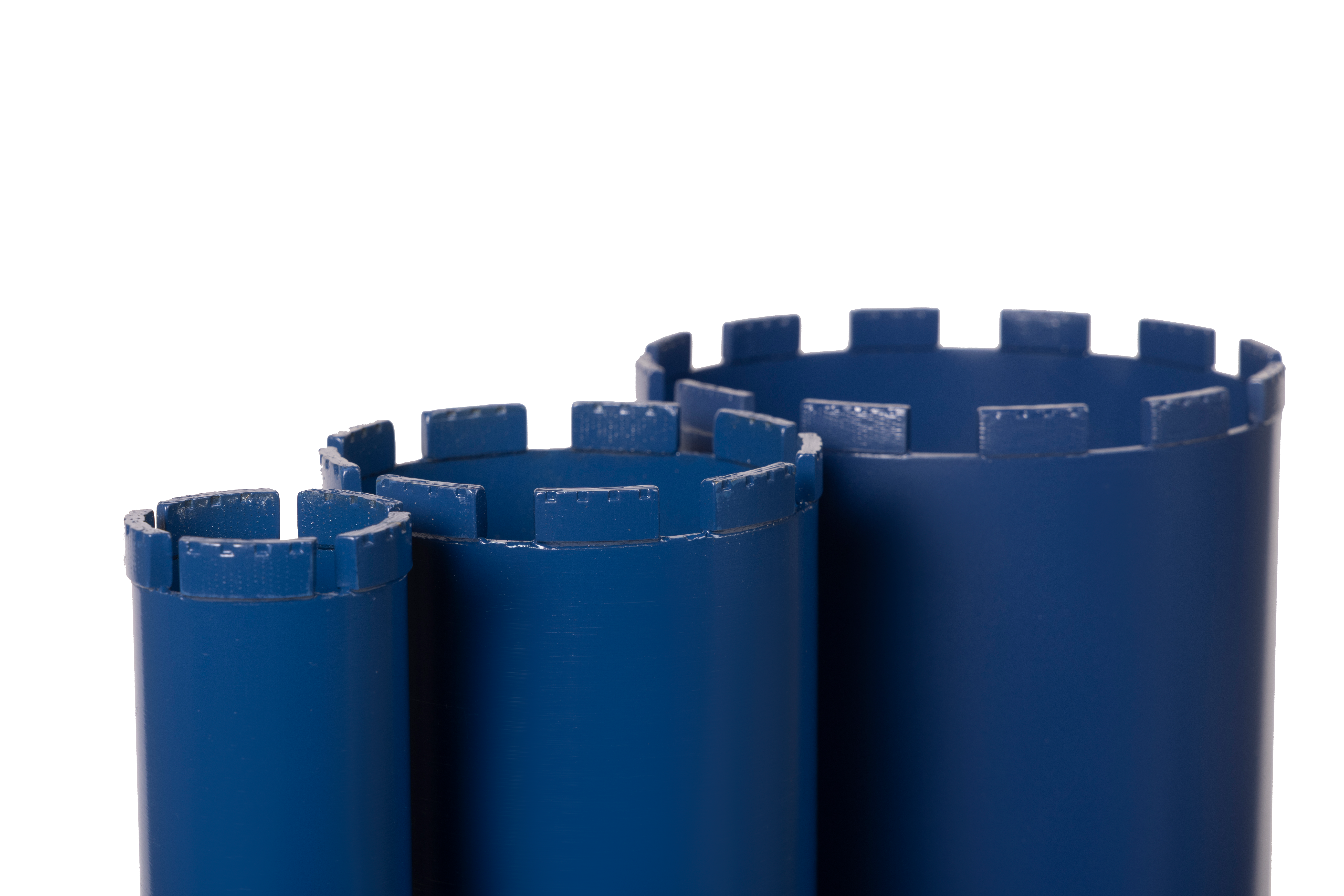 A side shot of 3 glacier diamond core bits of various sizes.